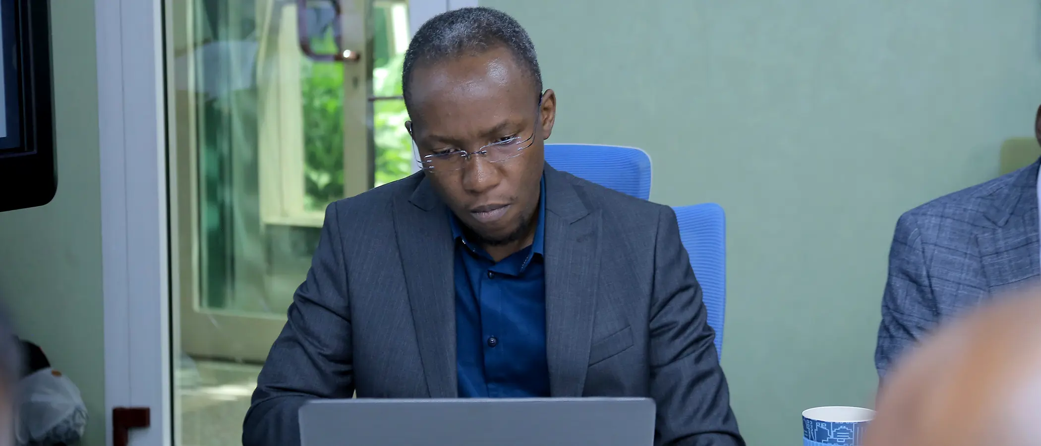 John Ssenkeezi working on a project